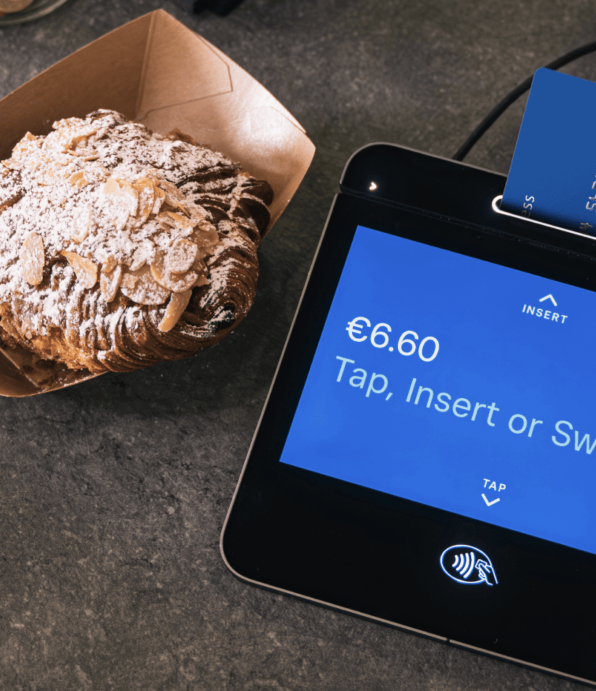 Square Register payment device on countertop with screen visible.
